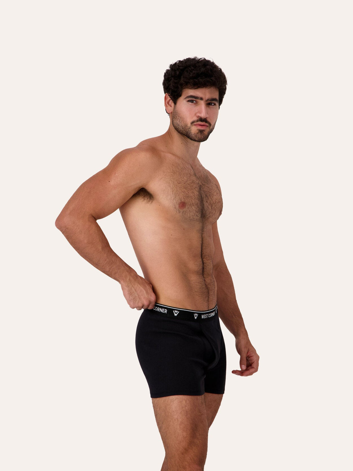 West Corner boxer brief in black — side, on model