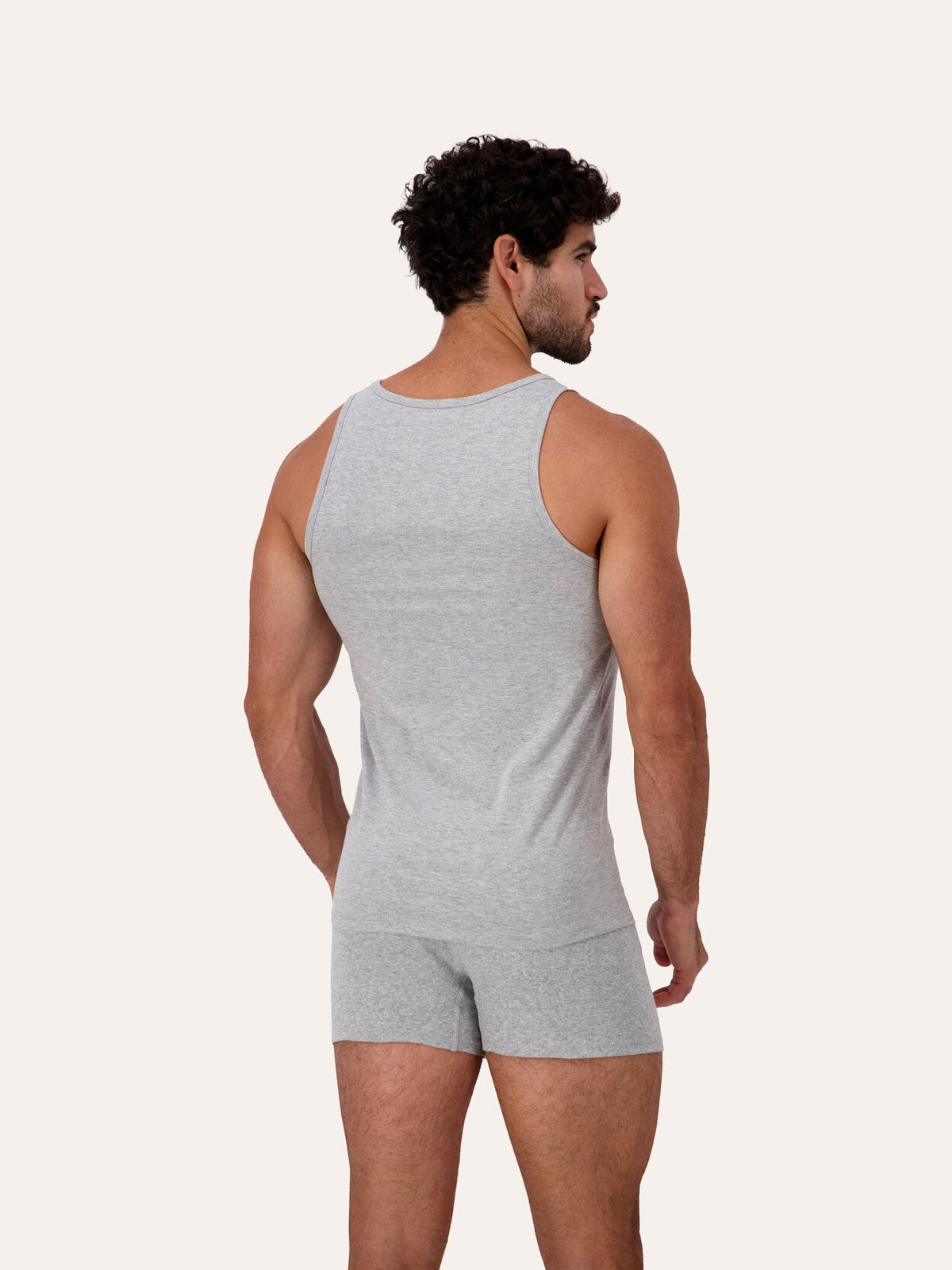 West Corner tank top in gray melange — back, three-quarter, on model