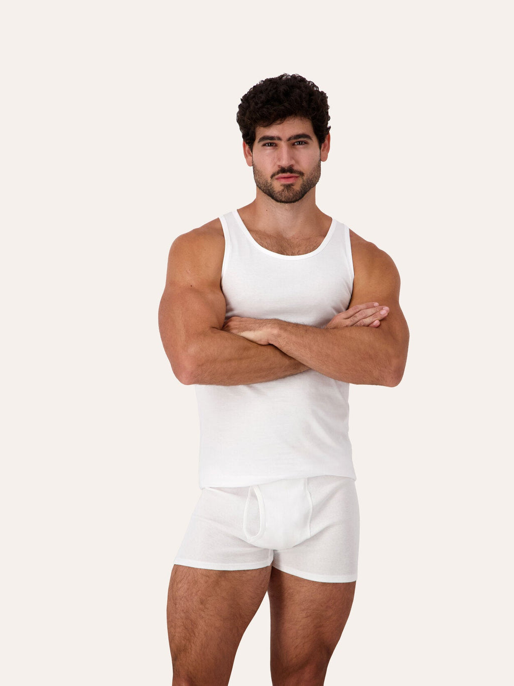 1 Pack / 3 Pack | West Corner tank top in white — front, arms crossed, on model