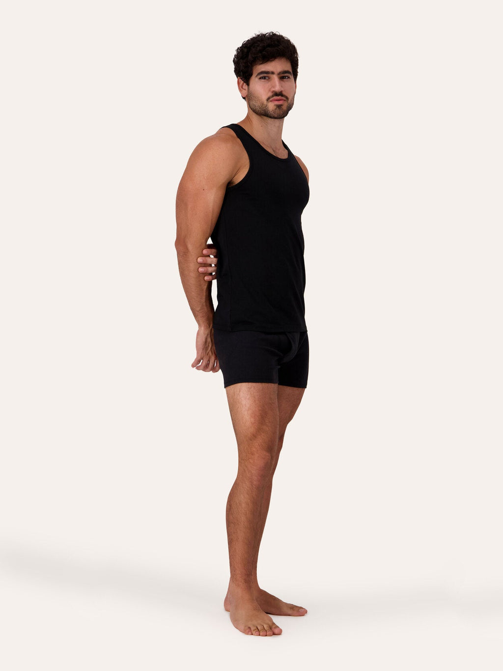 West Corner tank top in black — side, on model