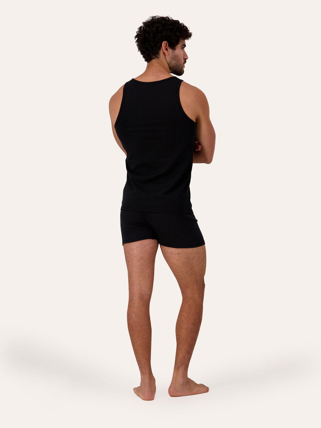 West Corner tank top in black — back, on model