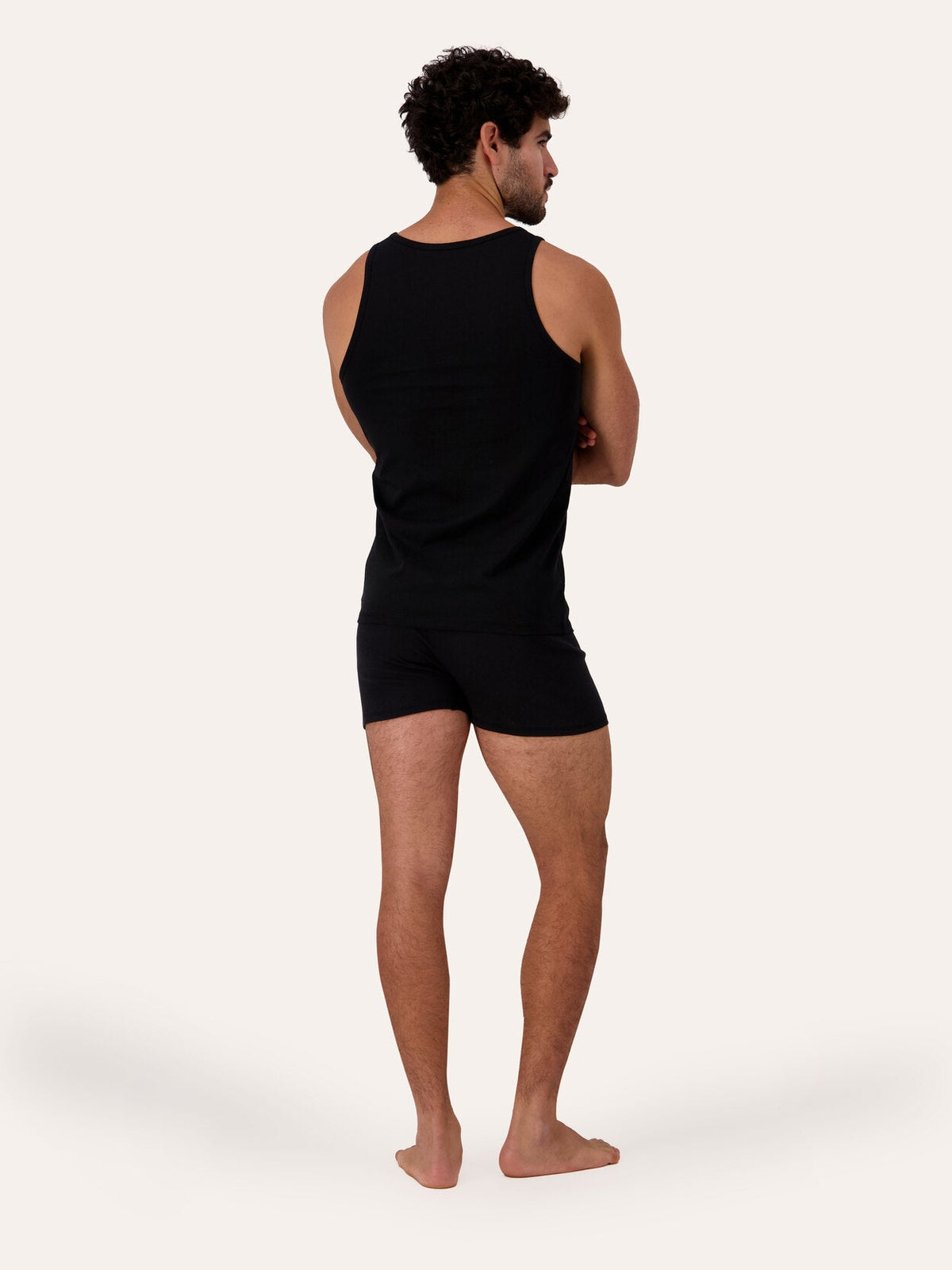 West Corner tank top in black — back, on model